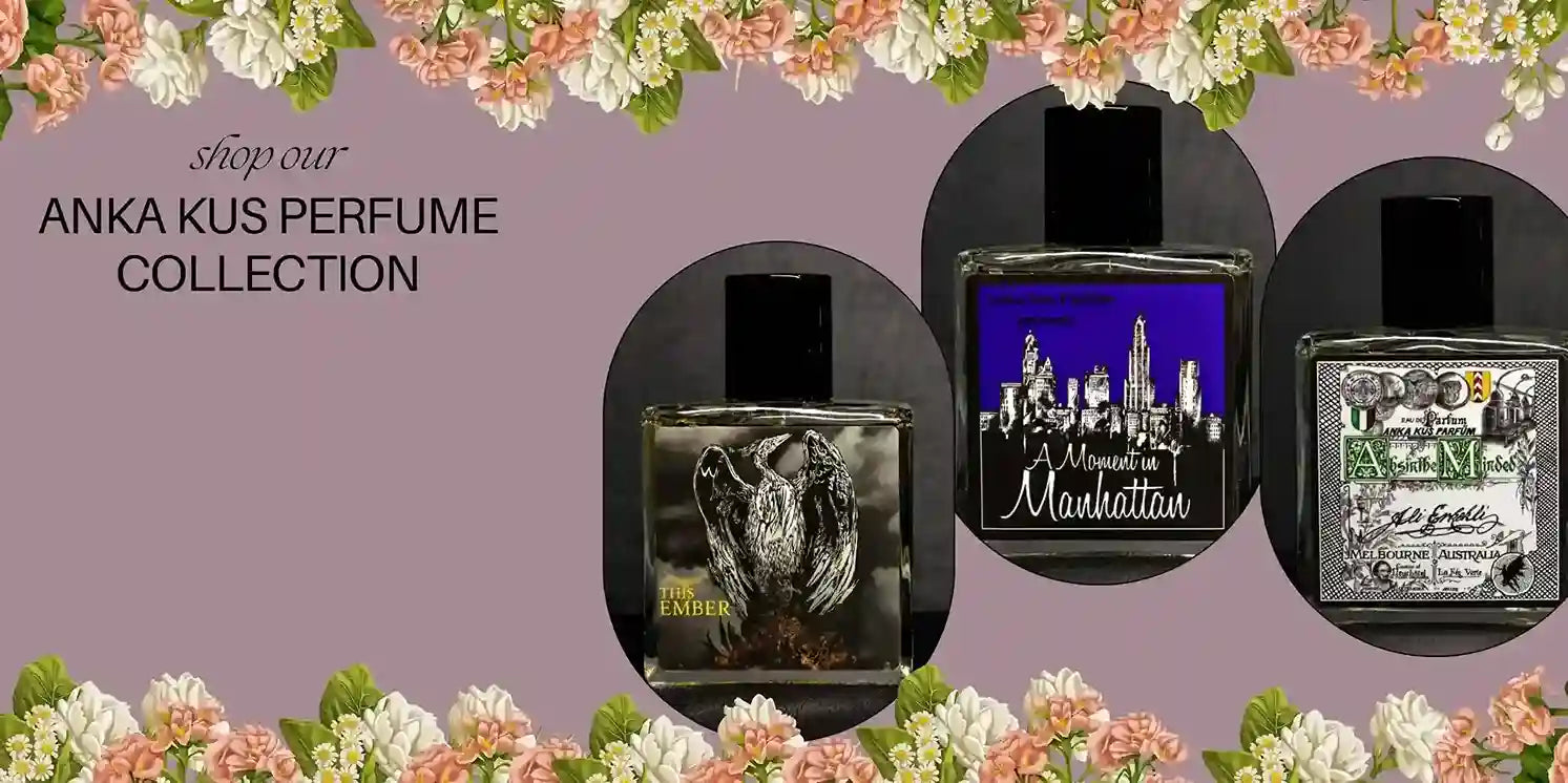 Three Anka Kus perfume bottles—This Ember, Moment in Manhattan, and Absinthe Minded—displayed against a lavender background with floral borders and collection title text.